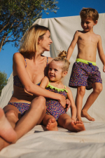 mother and son wearing a matching swimsuit graffiti