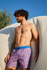 Man wearing a Pink Reef swimsuit with elasticated belt
