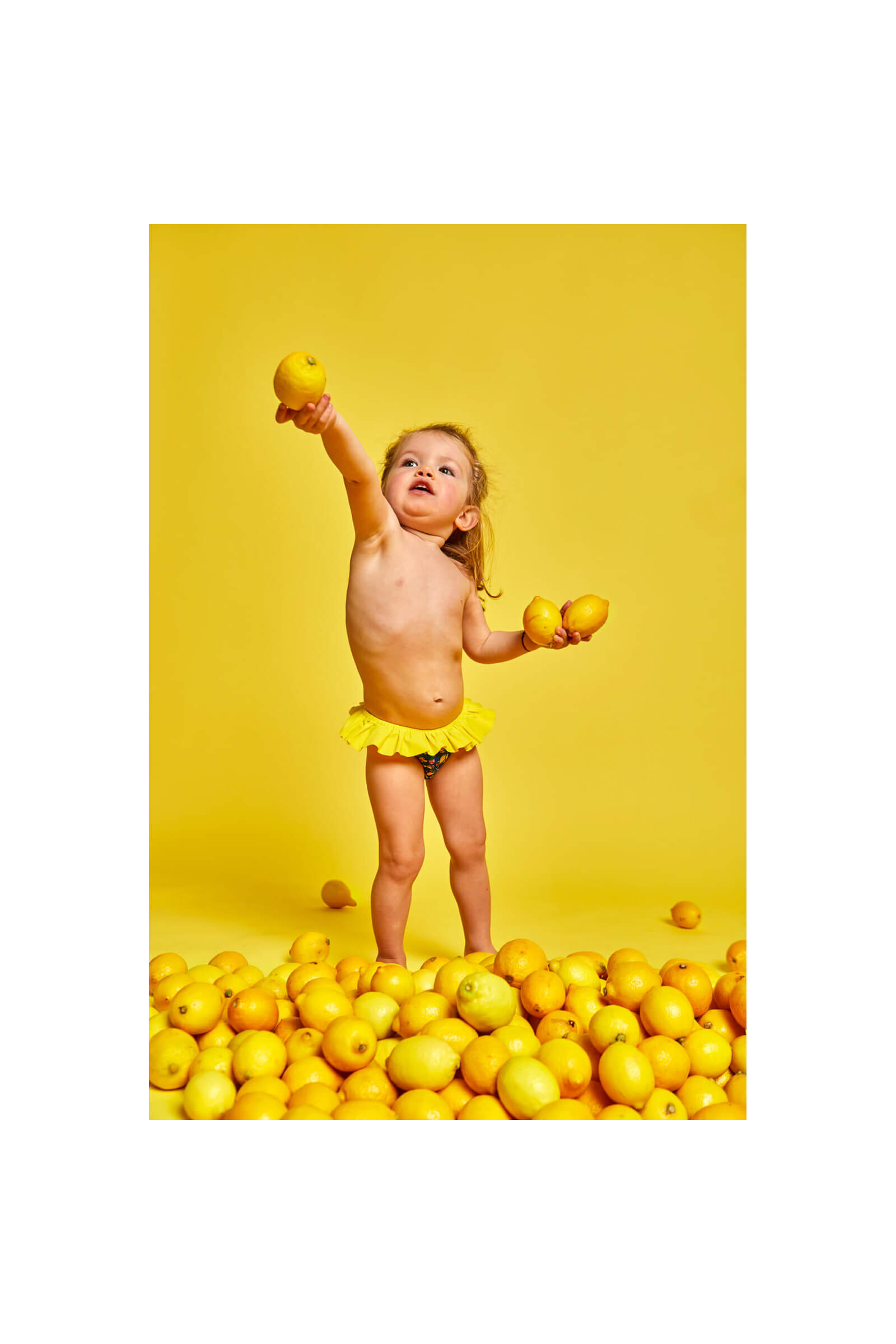 baby girl wearing a Lemonade bikini bottom