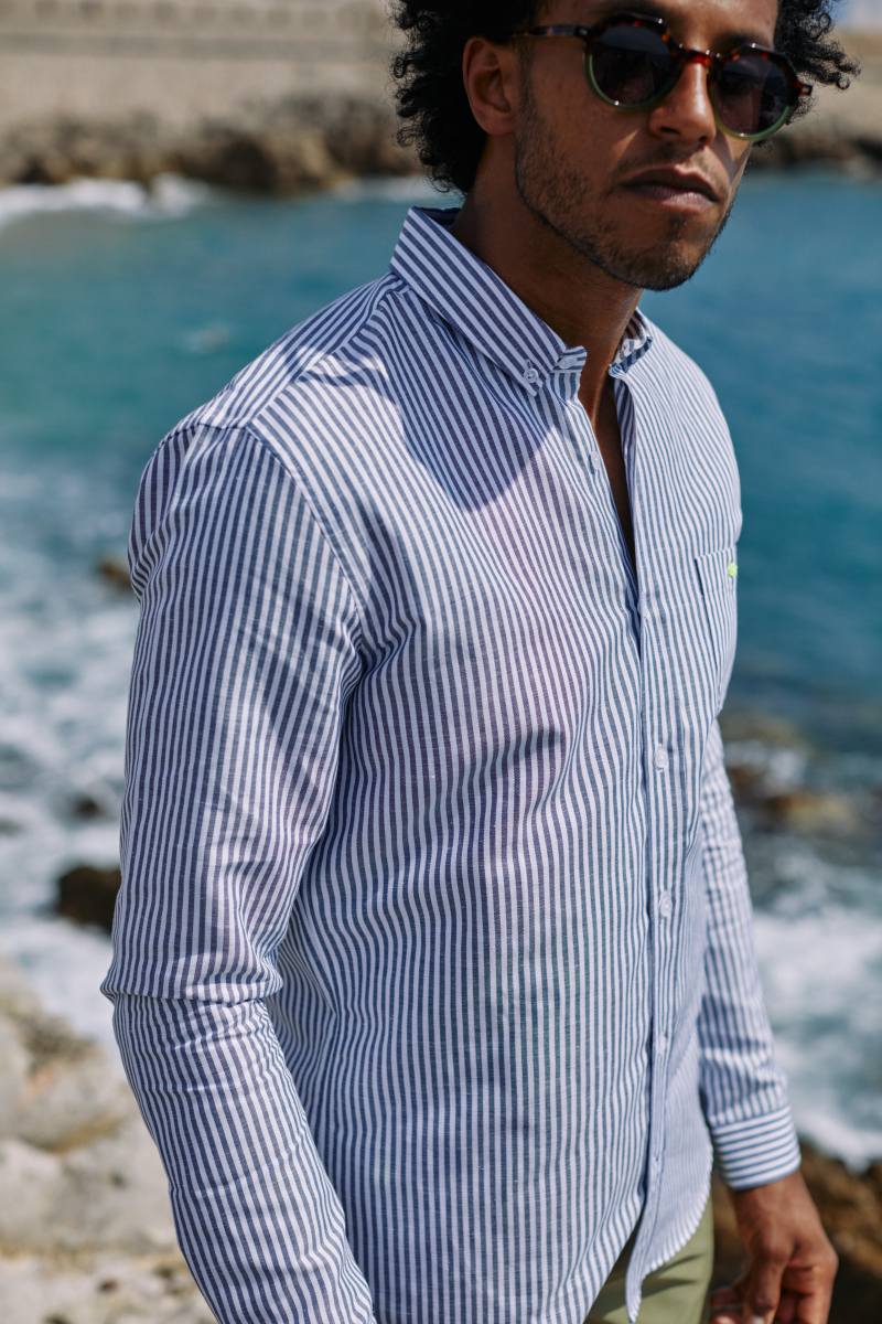 Man wearing a Blue and white striped shirt
