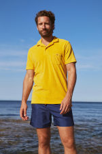 man wearing a yellow terry polo