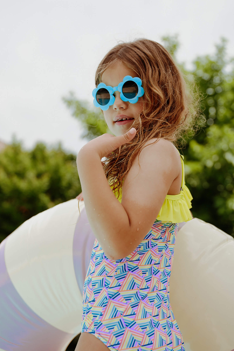 Girl wearing a one-piece swimsuit Rainbow Mountains