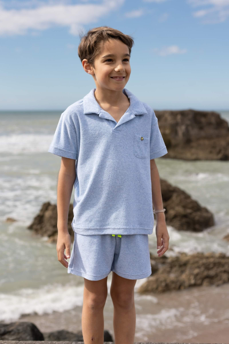 kid wearing a melange blue terry cloth short
